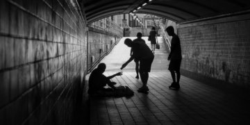 a group of people standing in a tunnel