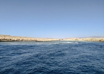a body of water next to the ocean