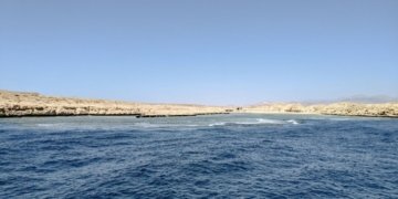 a body of water next to the ocean