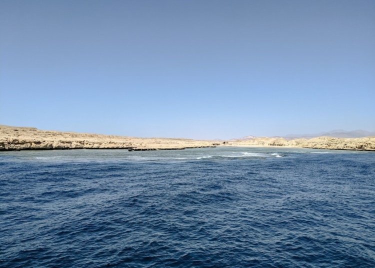 a body of water next to the ocean