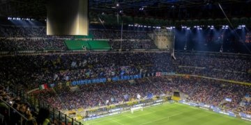 a stadium full of people watching a soccer game