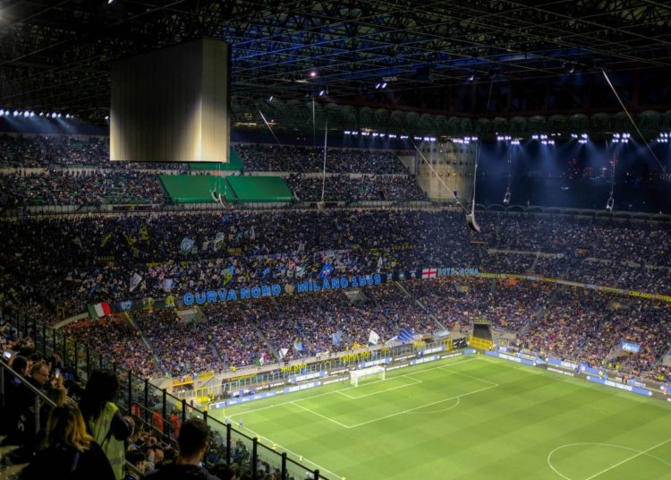 a stadium full of people watching a soccer game