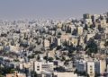 Aerial view of Amman, Jordan showcasing dense urban architecture and vibrant city life.