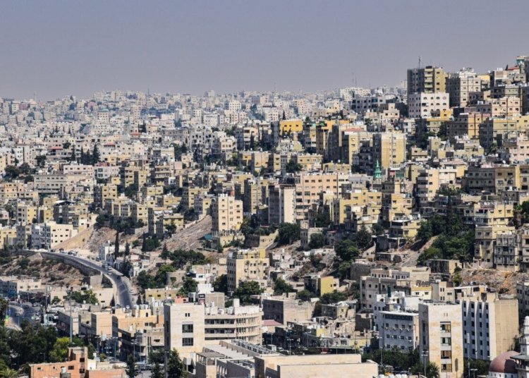 Aerial view of Amman, Jordan showcasing dense urban architecture and vibrant city life.