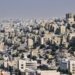 Aerial view of Amman, Jordan showcasing dense urban architecture and vibrant city life.