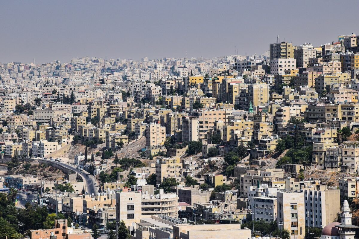 Aerial view of Amman, Jordan showcasing dense urban architecture and vibrant city life.