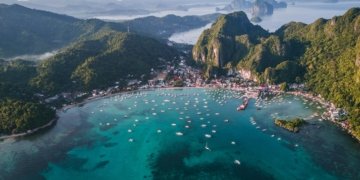 landscape photography of island with boats